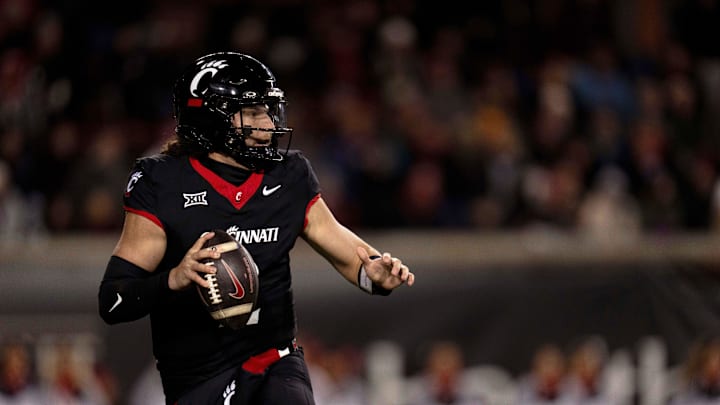 Nov 30, 2024; Cincinnati, Ohio, USA; Cincinnati Bearcats quarterback Brendan Sorsby (2) rolls out to throw against the TCU Horned Frogs in the first quarter at Nippert Stadium. Mandatory Credit: Albert Cesare/USA TODAY Network via Imagn Images