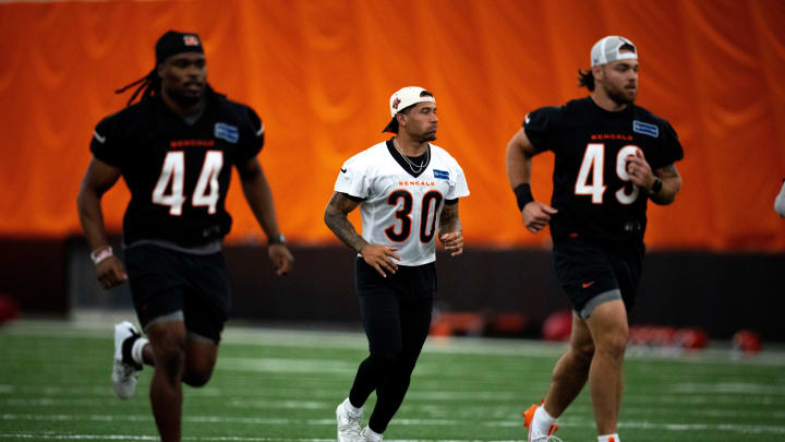 Cincinnati Bengals running back Chase Brown (30) jogs down the field for stretches at Bengals spring practice at the IEL Indoor Facility in Cincinnati on Wednesday, June 12, 2024.