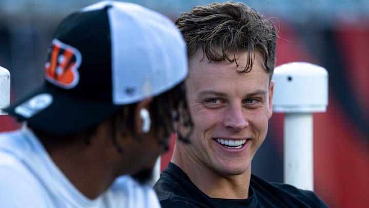 Cincinnati Bengals quarterback Joe Burrow (9) smiles while speaking with Cincinnati Bengals wide receiver Ja'Marr Chase (1) before stretching for the NFL game between the Cincinnati Bengals and Los Angeles Rams at Paycor Stadium in Cincinnati on Monday, Sept. 25, 2023. Cincinnati Bengals quarterback Joe Burrow (9) smiles while speaking with Cincinnati Bengals wide receiver Ja'Marr Chase (1) before stretching for the NFL game between the Cincinnati Bengals and Los Angeles Rams at Paycor Stadium in Cincinnati on Monday, Sept. 25, 2023.