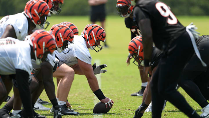 Jun 10, 2025; Cincinnati, OH, USA; Cincinnati Bengals center Ted Karras (64) lines up with the offensive line at the line of scrimmage against the defensive line during practice at Paycor Stadium. Mandatory Credit: Kareem Elgazzar-Imagn Images Jun 10, 2025; Cincinnati, OH, USA; Cincinnati Bengals center Ted Karras (64) lines up with the offensive line at the line of scrimmage against the defensive line during practice at Paycor Stadium. Mandatory Credit: Kareem Elgazzar-Imagn Images