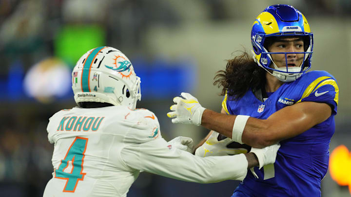 Los Angeles Rams wide receiver Puka Nacua (17) carries the ball against Miami Dolphins cornerback Kader Kohou (4) in the second half at SoFi Stadium.