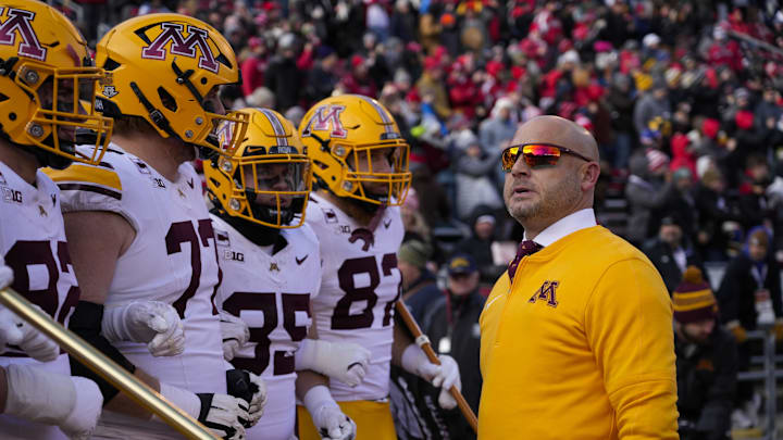 Nov 29, 2024; Madison, Wisconsin, USA;  Minnesota Golden Gophers head coach P.J. Fleck looks on before taking the field prior to the game against the Wisconsin Badgers at Camp Randall Stadium. Mandatory Credit: Jeff Hanisch-Imagn Images
