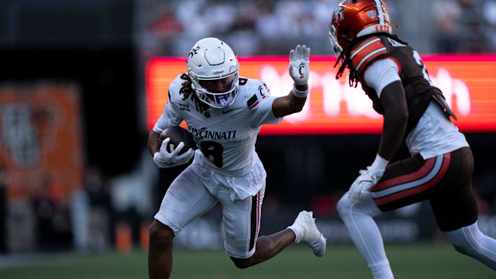 Cincinnati Bearcats wide receiver Noah Jennings (8) is tackled by Bowling Green Falcons cornerback MJ Cannon in the fourth quarter of the NCAA football game between the Cincinnati Bearcats and Bowling Green Falcons at Nippert Stadium in Cincinnati on Sept. 6, 2025. Cincinnati Bearcats wide receiver Noah Jennings (8) is tackled by Bowling Green Falcons cornerback MJ Cannon in the fourth quarter of the NCAA football game between the Cincinnati Bearcats and Bowling Green Falcons at Nippert Stadium in Cincinnati on Sept. 6, 2025.