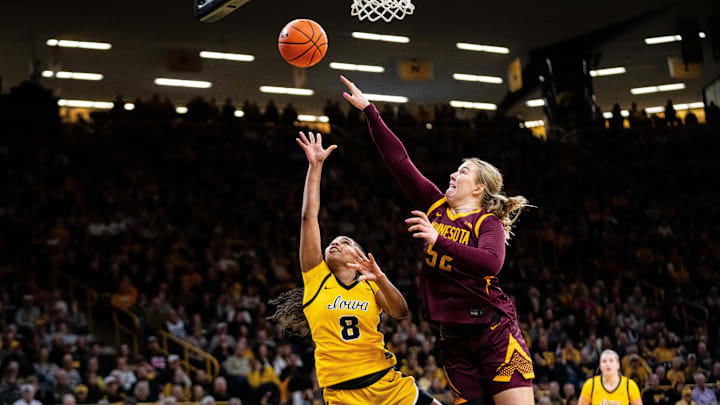 Iowa guard Journey Houston (8) shoots the ball against Minnesota center Sophie Hart (52) on Feb. 5, 2026, at Carver-Hawkeye Arena.