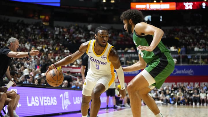 Jul 15, 2024; Las Vegas, NV, USA; Los Angeles Lakers guard Bronny James (9) dribbles the ball against Boston Celtics forward Anton Watson (28) during the first half at Thomas & Mack Center. Mandatory Credit: Lucas Peltier-USA TODAY Sports