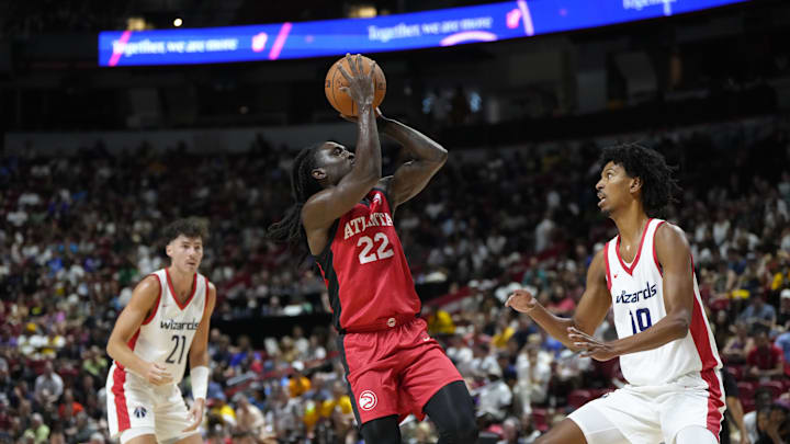 Jul 12, 2024; Las Vegas, NV, USA;  Atlanta Hawks guard Keaton Wallace (22) shoots the ball against Washington Wizards forward John Butler Jr. (19) during the first half at Thomas & Mack Center. Mandatory Credit: Lucas Peltier-Imagn Images
