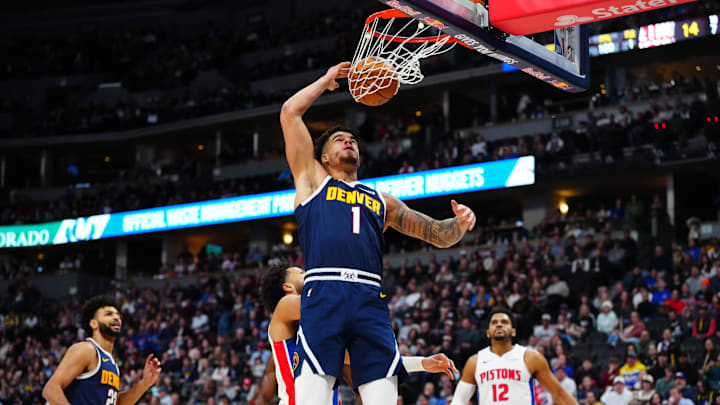 Dec 28, 2024; Denver, Colorado, USA; Denver Nuggets forward Michael Porter Jr. (1) finishes off a basket in the first quarter against the Detroit Pistons at Ball Arena. Mandatory Credit: Ron Chenoy-Imagn Images Dec 28, 2024; Denver, Colorado, USA; Denver Nuggets forward Michael Porter Jr. (1) finishes off a basket in the first quarter against the Detroit Pistons at Ball Arena. Mandatory Credit: Ron Chenoy-Imagn Images