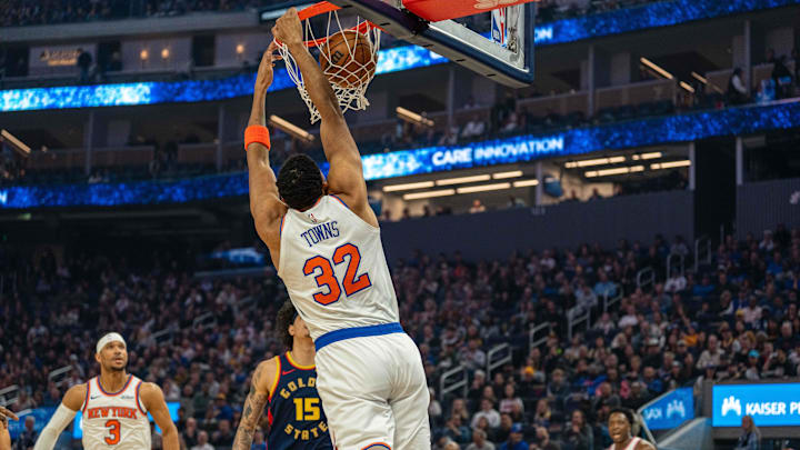 Mar 15, 2025; San Francisco, California, USA; New York Knicks center Karl-Anthony Towns (32) dunks the basketball against the Golden State Warriors during the first quarter at Chase Center. Mandatory Credit: Neville E. Guard-Imagn Images