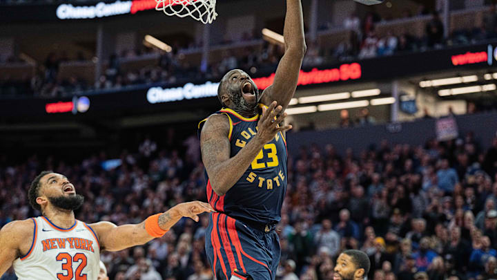 Mar 15, 2025; San Francisco, California, USA; Golden State Warriors forward Draymond Green (23) shoots a layup against New York Knicks center Karl-Anthony Towns (32) during the fourth quarter at Chase Center. Mandatory Credit: Neville E. Guard-Imagn Images