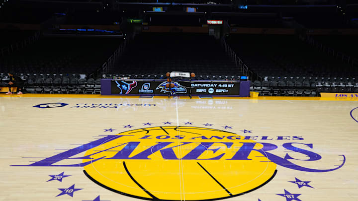 Jan 17, 2024; Los Angeles, California, USA; The Los Angeles Lakers logo at center court at the Crypto.com Arena. Mandatory Credit: Kirby Lee-Imagn Images Jan 17, 2024; Los Angeles, California, USA; The Los Angeles Lakers logo at center court at the Crypto.com Arena. Mandatory Credit: Kirby Lee-Imagn Images
