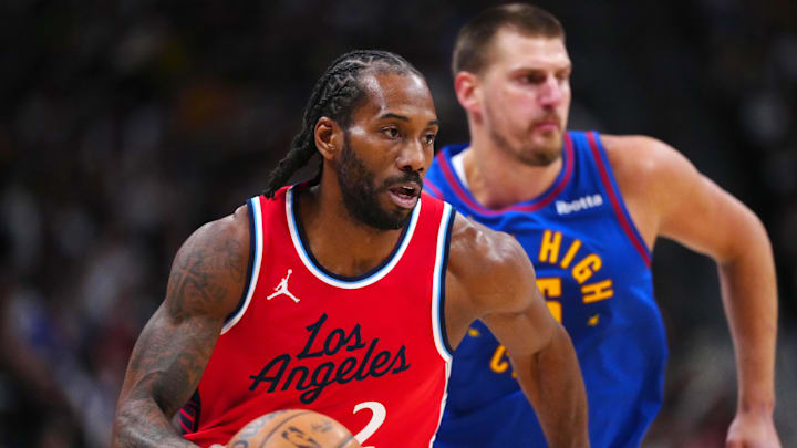 May 3, 2025; Denver, Colorado, USA; LA Clippers forward Kawhi Leonard (2) controls the ball in the first quarter against the Denver Nuggets during game seven of first round for the 2025 NBA Playoffs at Ball Arena. Mandatory Credit: Ron Chenoy-Imagn Images