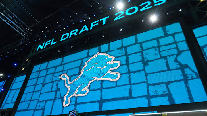 The Detroit Lions logo is projected on draft stage screen during the NFL Draft at Lambeau Field. 