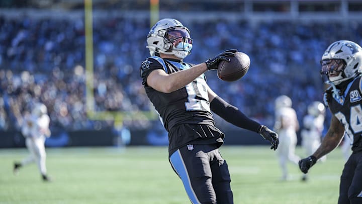 Dec 22, 2024; Charlotte, North Carolina, USA;  Carolina Panthers wide receiver Adam Thielen (19) reacts to his touchdown catch against the Arizona Cardinals during the second quarter at Bank of America Stadium. Mandatory Credit: Jim Dedmon-Imagn Images