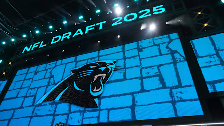 The Carolina Panthers logo is projected on the video board 