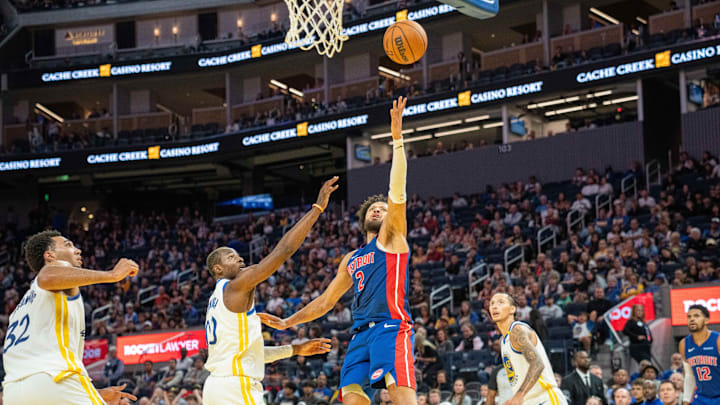 Oct 13, 2024; San Francisco, California, USA;  Detroit Pistons guard Cade Cunningham (2) shoot the layup against Golden State Warriors forward Jonathan Kuminga (00) during the second quarter at Chase Center. Mandatory Credit: Neville E. Guard-Imagn Images