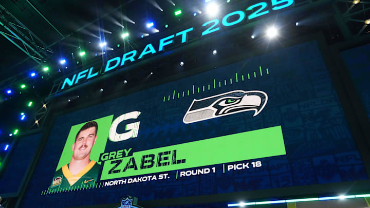 Apr 24, 2025; Green Bay, WI, USA; North Dakota State guard Grey Zabel is selected as the No. 18 pick by the Seattle Seahawks during the NFL Draft at Lambeau Field. Mandatory Credit: Kirby Lee-Imagn Images Apr 24, 2025; Green Bay, WI, USA; North Dakota State guard Grey Zabel is selected as the No. 18 pick by the Seattle Seahawks during the NFL Draft at Lambeau Field. Mandatory Credit: Kirby Lee-Imagn Images
