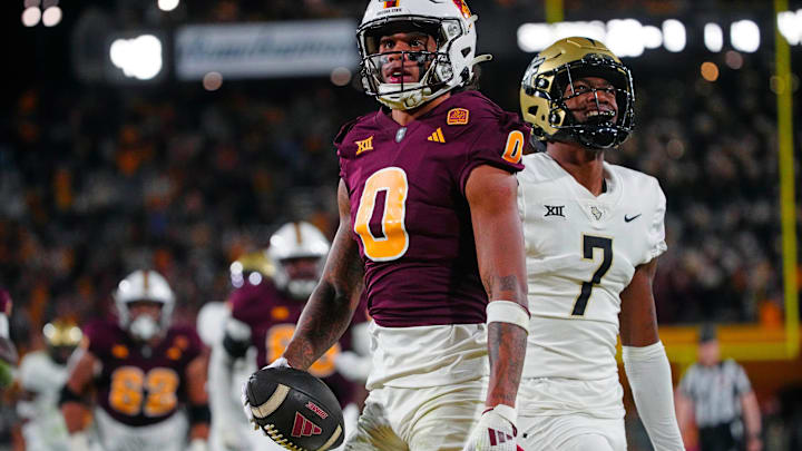 ASU wide receiver Jordyn Tyson (0) celebrates a touchdown catch against UCF defensive back Antione Jackson (7) during a game at Mountain America Stadium in Tempe on Nov. 9, 2024.
