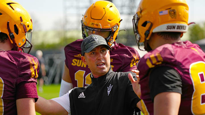 ASU assistant coach Jason Mohns talks with his players during a spring practice at the Kajikawa practice fields in Tempe on March 14, 2023.

Football Asu Spring