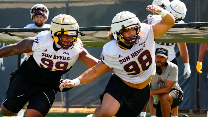 Arizona State defensive linemen CJ Fite (99) and Jacob Rich Kongaika (98) run a drill during the first day of fall practice in Tempe, Ariz. on July 30, 2025. Arizona State defensive linemen CJ Fite (99) and Jacob Rich Kongaika (98) run a drill during the first day of fall practice in Tempe, Ariz. on July 30, 2025.