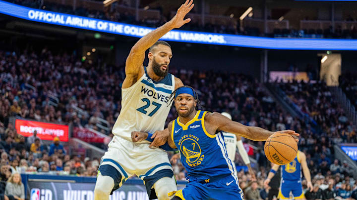 Dec 6, 2024; San Francisco, California, USA; Golden State Warriors guard Buddy Hield (7) drive to the net against Minnesota Timberwolves center Rudy Gobert (27) during the fourth quarter at Chase Center. Mandatory Credit: Neville E. Guard-Imagn Images Dec 6, 2024; San Francisco, California, USA; Golden State Warriors guard Buddy Hield (7) drive to the net against Minnesota Timberwolves center Rudy Gobert (27) during the fourth quarter at Chase Center. Mandatory Credit: Neville E. Guard-Imagn Images