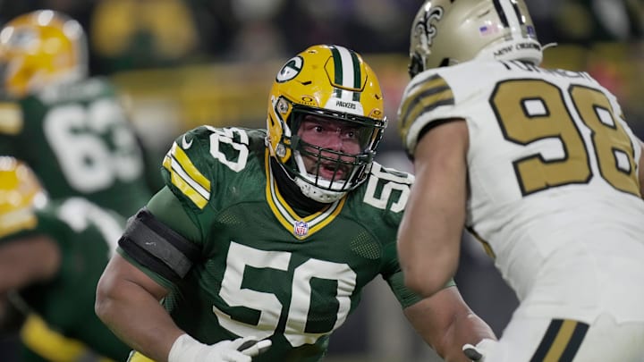 Green Bay Packers guard Zach Tom blocks New Orleans Saints defensive end Payton Turner during the third quarter of their game Monday, December 23, 2024 at Lambeau Field in Green Bay, Wisconsin.