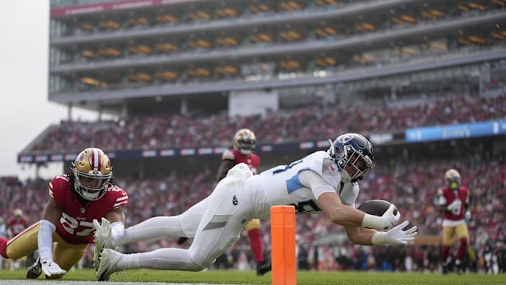 Dec 14, 2025; Santa Clara, California, USA; Tennessee Titans tight end Gunnar Helm (84) scores a touchdown a- San Francisco 49ers safety Ji'Ayir Brown (27) during the second quarter at Levi's Stadium. Mandatory Credit: Kyle Terada-Imagn Images Dec 14, 2025; Santa Clara, California, USA; Tennessee Titans tight end Gunnar Helm (84) scores a touchdown a- San Francisco 49ers safety Ji'Ayir Brown (27) during the second quarter at Levi's Stadium. Mandatory Credit: Kyle Terada-Imagn Images