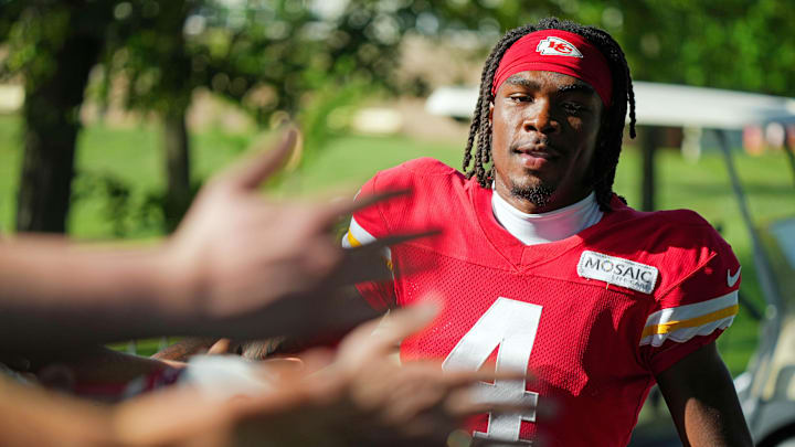 Jul 28, 2023; St. Joseph, MO, USA; Kansas City Chiefs wide receiver Rashee Rice (4) greets fans as he arrives prior to training camp at Missouri Western State University. Mandatory Credit: Jay Biggerstaff-Imagn Images