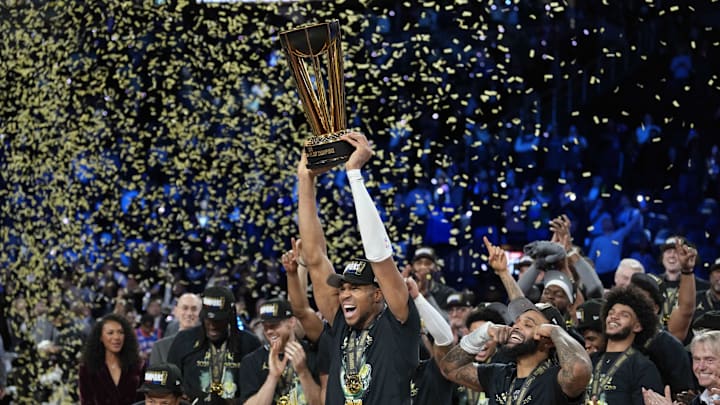 Dec 17, 2024; Las Vegas, Nevada, USA; Milwaukee Bucks forward Giannis Antetokounmpo (34) celebrates with the trophy and teammates after winning the Emirates NBA Cup championship game against the Oklahoma City Thunder at T-Mobile Arena. Mandatory Credit: Kyle Terada-Imagn Images