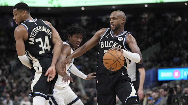 Feb 2, 2025; Milwaukee, Wisconsin, USA; Milwaukee Bucks forward Khris Middleton (22) drives around a pick set by Milwaukee Bucks forward Giannis Antetokounmpo (34) in the first half against Memphis Grizzlies forward GG Jackson (45) in the first half at Fiserv Forum. Mandatory Credit: Michael McLoone-Imagn Images