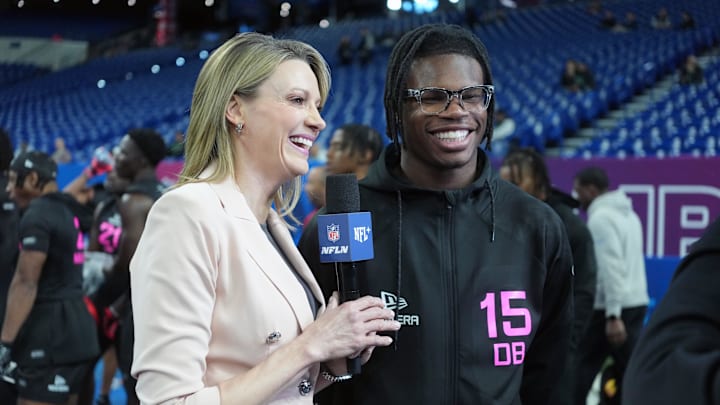 Feb 28, 2025; Indianapolis, IN, USA; Stacey Dales interviews Colorado defensive back Travis Hunter (DB15) looks on during the 2025 NFL Combine at Lucas Oil Stadium. Mandatory Credit: Kirby Lee-Imagn Images