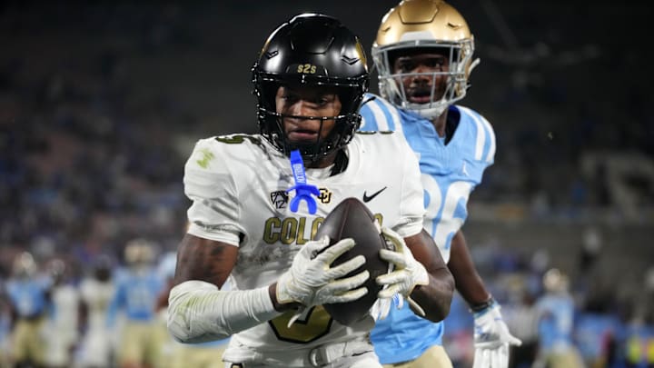 Oct 28, 2023; Pasadena, California, USA; Colorado Buffaloes wide receiver Jimmy Horn Jr. (5) catches an 18-yard touchdown pass against the UCLA Bruins in the second half at Rose Bowl. UCLA defeated Colorado 28-16. Mandatory Credit: Kirby Lee-Imagn Images