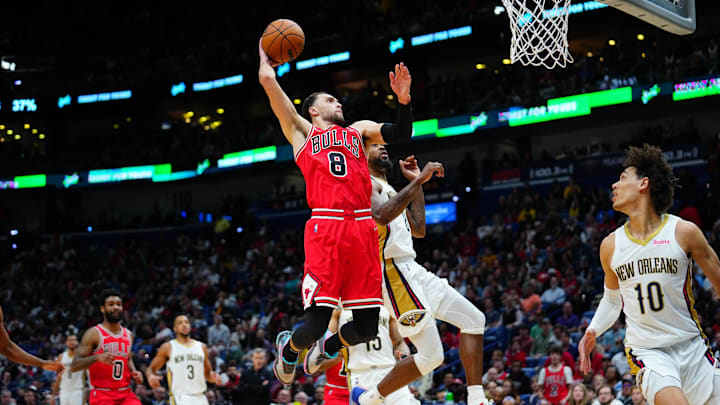 Chicago Bulls guard Zach LaVine (8) dunks the ball against New Orleans Pelicans forward Naji Marshall (8) during the third quarter at Smoothie King Center. Mandatory Credit: Andrew Wevers-Imagn Images