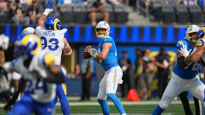 Aug 16, 2025; Inglewood, California, USA; Los Angeles Chargers quarterback Justin Herbert (10) throws the ball against the Los Angeles Rams in the first half at SoFi Stadium. Mandatory Credit: Kirby Lee-Imagn Images