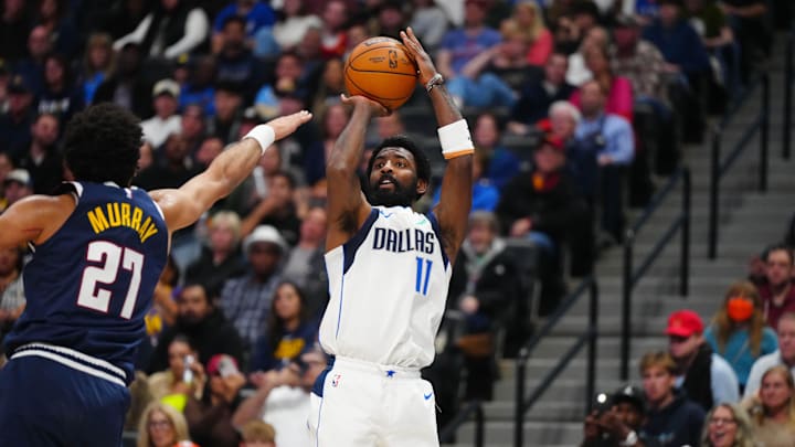 Nov 10, 2024; Denver, Colorado, USA; Dallas Mavericks guard Kyrie Irving (11) prepares to shoot the ball in the fourth quarter against the Denver Nuggets at Ball Arena. Mandatory Credit: Ron Chenoy-Imagn Images