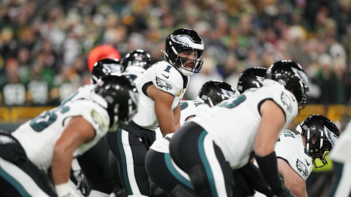 Nov 10, 2025; Green Bay, Wisconsin, USA; Philadelphia Eagles quarterback Jalen Hurts (1) under center against the Green Bay Packers in the first half at Lambeau Field. Mandatory Credit: Jeff Hanisch-Imagn Images