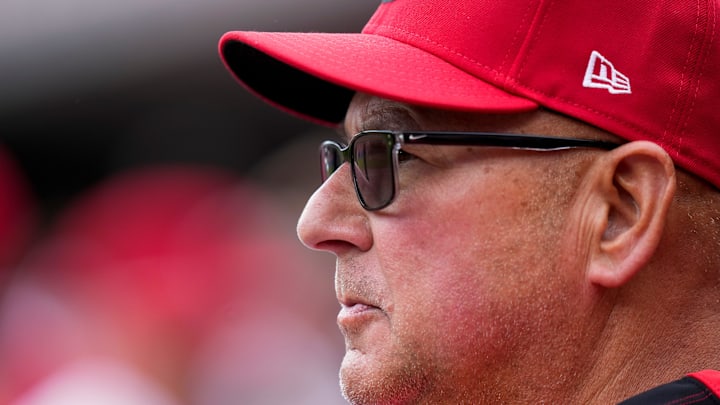 Cincinnati Reds manager Terry Francona (77) watches from the dugout in the third inning of the MLB Interleague game between the Cincinnati Reds and the Texas Rangers at Great American Ball Park in downtown Cincinnati on Wednesday, April 2, 2025. The Rangers led 1-0 after four innings.