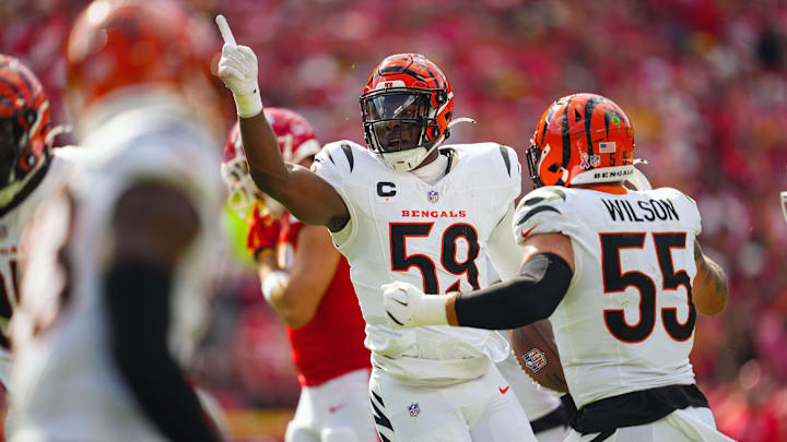 Sep 15, 2024; Kansas City, Missouri, USA; Cincinnati Bengals linebacker Akeem Davis-Gaither (59) celebrates after an interception during the first half against the Kansas City Chiefs at GEHA Field at Arrowhead Stadium.  
