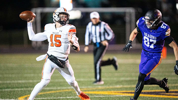 Valley’s Drake DeGroote (15) throws during a quarterfinal game against Johnston on Nov. 7, 2025, at Johnston High School.
