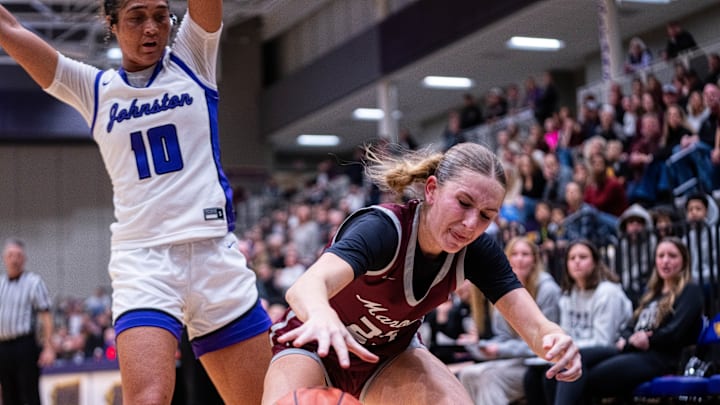 Dowling’s Ellie Muller (23) reaches for the ball as it goes out of bounds on Dec. 16, 2025, at Johnston High School. Dowling’s Ellie Muller (23) reaches for the ball as it goes out of bounds on Dec. 16, 2025, at Johnston High School.
