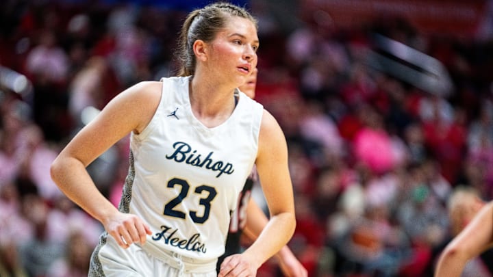 Bishop Heelan's Melina Snoozy (23) runs across the baseline on defense on March 3, 2026, at Casey’s Center in Des Moines.
