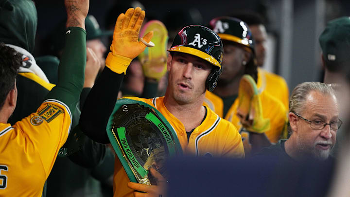 May 31, 2025; Toronto, Ontario, CAN; Athletics designated hitter Brent Rooker (25) celebrates in the dugout after hitting a two run home run against the Toronto Blue Jays during the ninth inning at Rogers Centre. Mandatory Credit: Nick Turchiaro-Imagn Images May 31, 2025; Toronto, Ontario, CAN; Athletics designated hitter Brent Rooker (25) celebrates in the dugout after hitting a two run home run against the Toronto Blue Jays during the ninth inning at Rogers Centre. Mandatory Credit: Nick Turchiaro-Imagn Images