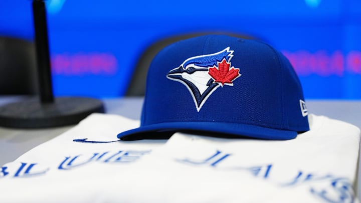  The baseball cap and jersey sit on the table before the press conference of Toronto Blue Jays 