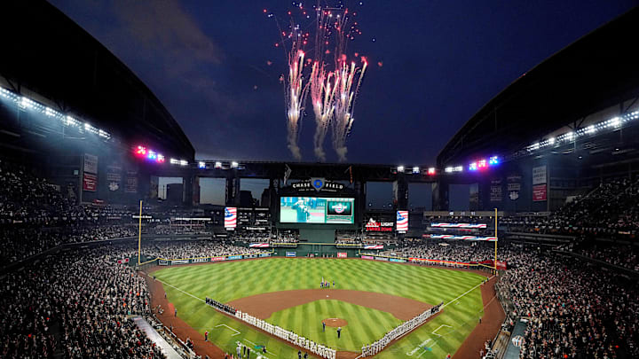 Fireworks go off after the signing of the national anthem during Opening Day game between the Diamondbacks and the Rockies at Chase Field.
