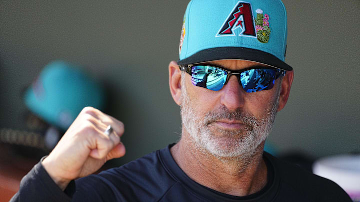 Diamondbacks manager Torey Lovullo fist bumps players during a spring training game in Surprise on Feb. 24, 2026.
