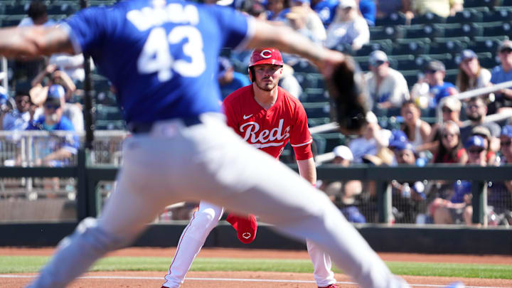 Feb 24, 2025; Goodyear, Arizona, USA; Cincinnati Reds second base Gavin Lux (2) leads off first base as Los Angeles Dodgers pitcher Anthony Banda (43) pitches during the second inning at Goodyear Ballpark. Mandatory Credit: Joe Camporeale-Imagn Images