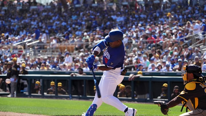 Feb 23, 2025; Phoenix, Arizona, USA; Los Angeles Dodgers right fielder Zyhir Hope (94) hits an RBI against the San Diego Padres during the second inning at Camelback Ranch-Glendale. Mandatory Credit: Joe Camporeale-Imagn Images