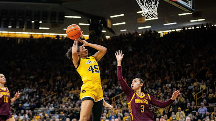 Iowa forward Hannah Stuelke (45) looks to shoot against Minnesota guard Amaya Battle (3) on Feb. 5, 2026, at Carver-Hawkeye Arena.
