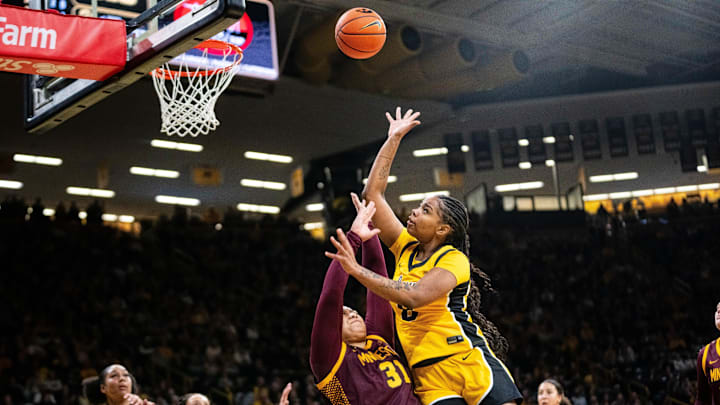 Iowa guard Journey Houston (8) takes a shot at the basket against Minnesota forward Finau Tonga (31) on Feb. 5, 2026, at Carver-Hawkeye Arena.