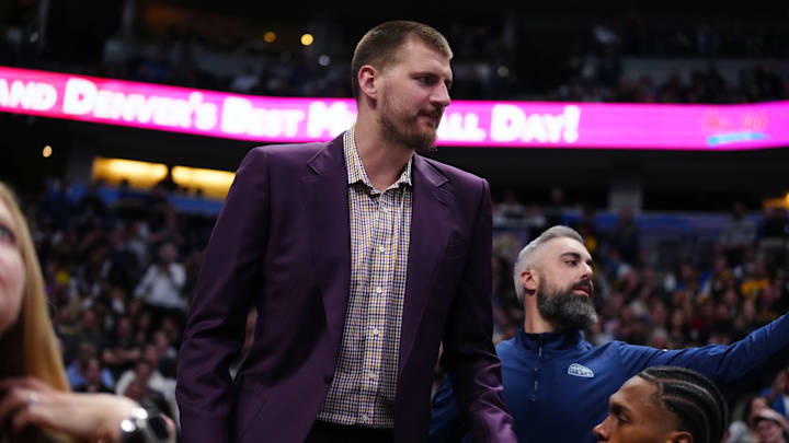 Apr 10, 2026; Denver, Colorado, USA; Denver Nuggets center Nikola Jokic (15) arrives during the first quarter against the Oklahoma City Thunder at Ball Arena. Mandatory Credit: Ron Chenoy-Imagn Images