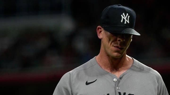 New York Yankees pitcher Ian Hamilton (71) returns to the dugout after being replaced by Tim Hill in the bottom of the seventh inning of the MLB interleague game between the Cincinnati Reds and the New York Yankees at Great American Ball Park in downtown Cincinnati on Monday, June 23, 2025.